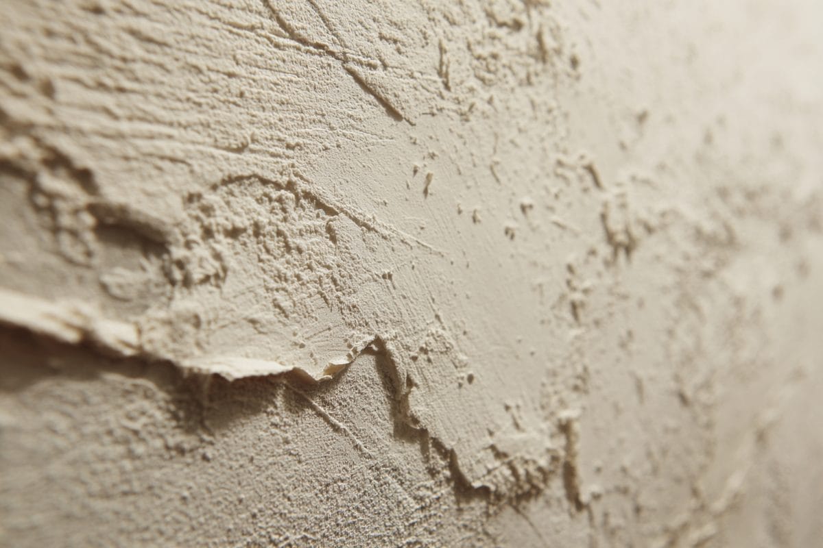 Smooth drywall wall after wallpaper removal, showing prepared surface ready for primer
