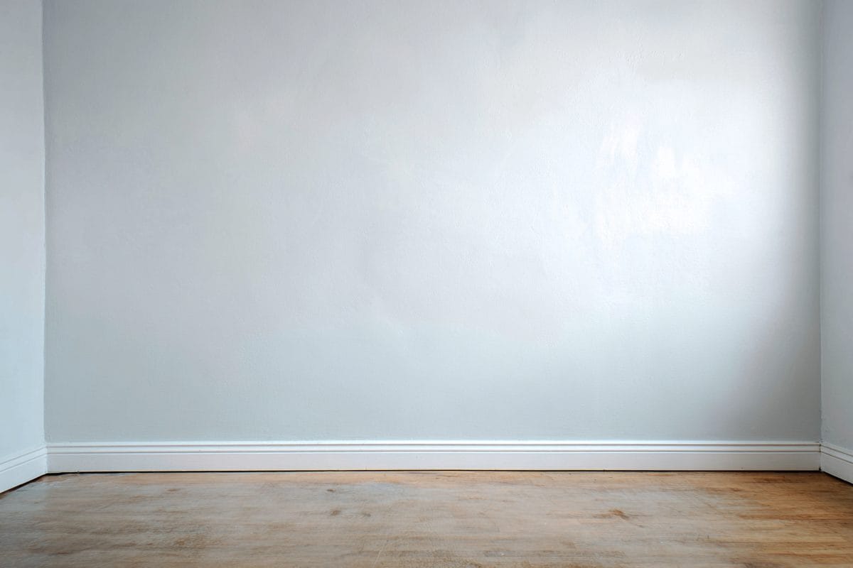 Interior wall after wallpaper border removal and repainting, finished professional appearance